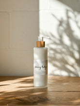 Load image into Gallery viewer, snowy lodge hydrating body lotion | amber, vanilla & cedar | the winter collection