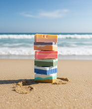Load image into Gallery viewer, Stack of colorful soap bars on a blurred natural background